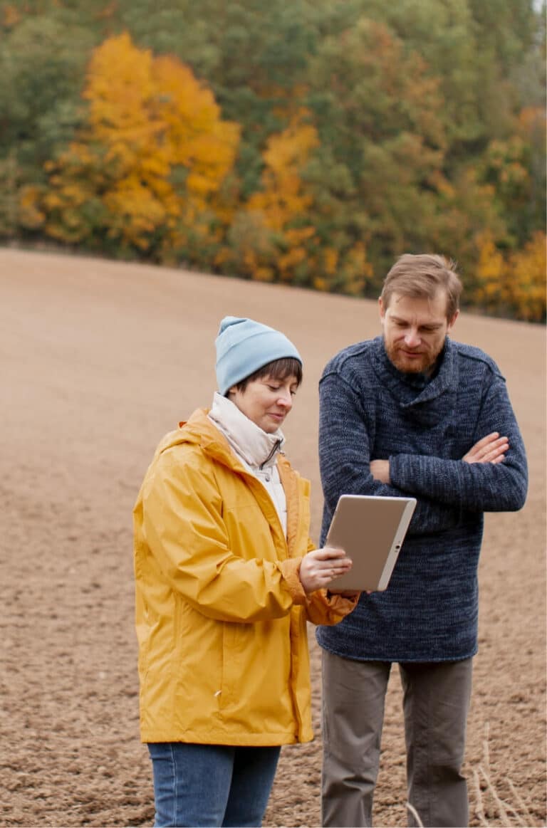 close up farmer using digital device